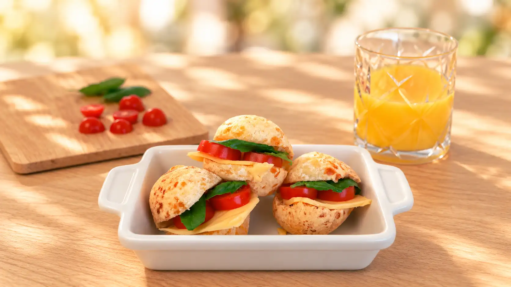 Small cheese bread sandwiches filled with cheese, tomato and greens